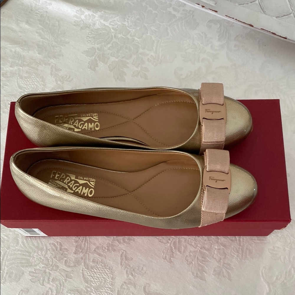 Salvatore Ferragamo Gold Flats with Bow Detail